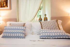 Отель Palazzo Taranto Luxury Rooms  Кальтаджироне